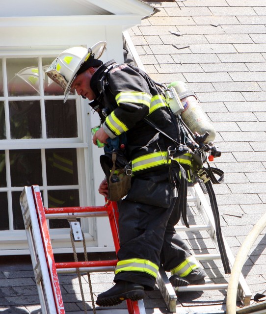 Assistant Chief Liburdi coming down off the roof @ 77 Chestnut Ridge rd Photo courtesy Frank Becerra